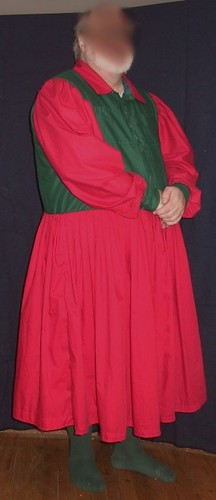 "man in red dress, standing"